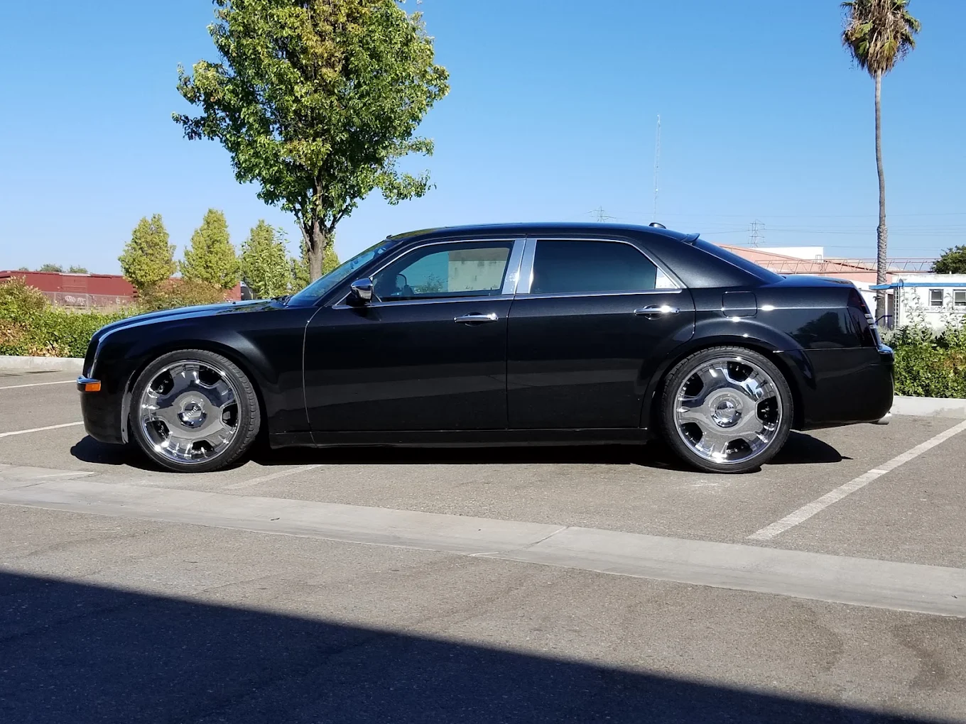 Detailed black Chrysler 300 with chrome wheels